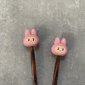 maschenstopper grinsekopf rosa